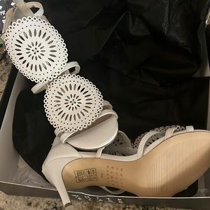 New with tags White House black market never worn strappy back zip heels.